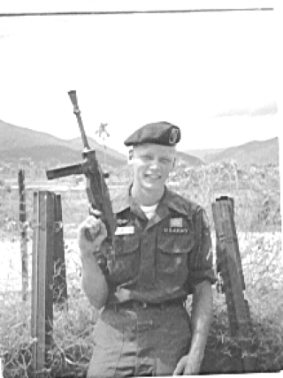 Joe in Viet Nam w gun.jpg